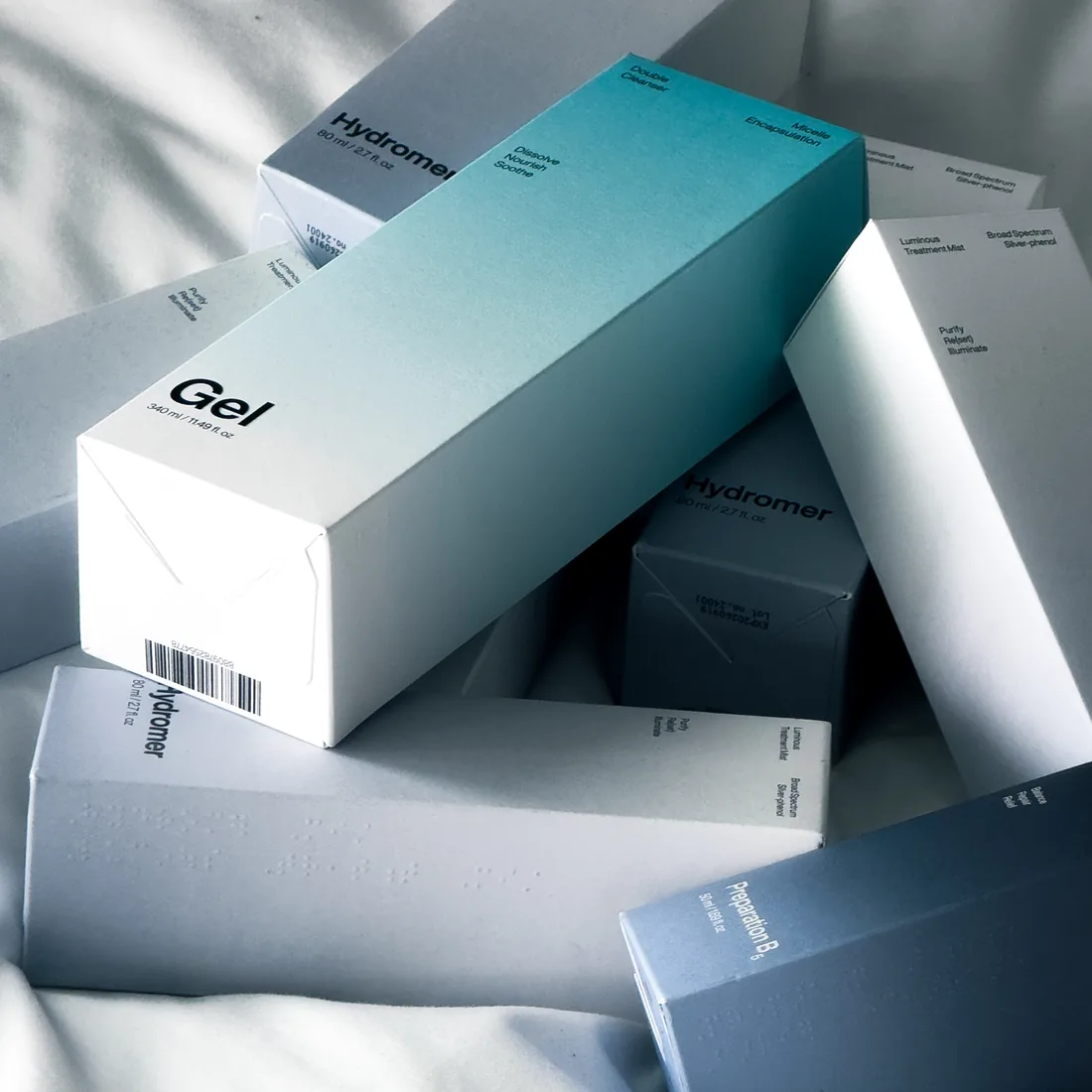 Slurp packaging: Hydromer, Gel and Preparation B cartons stacked in daylight