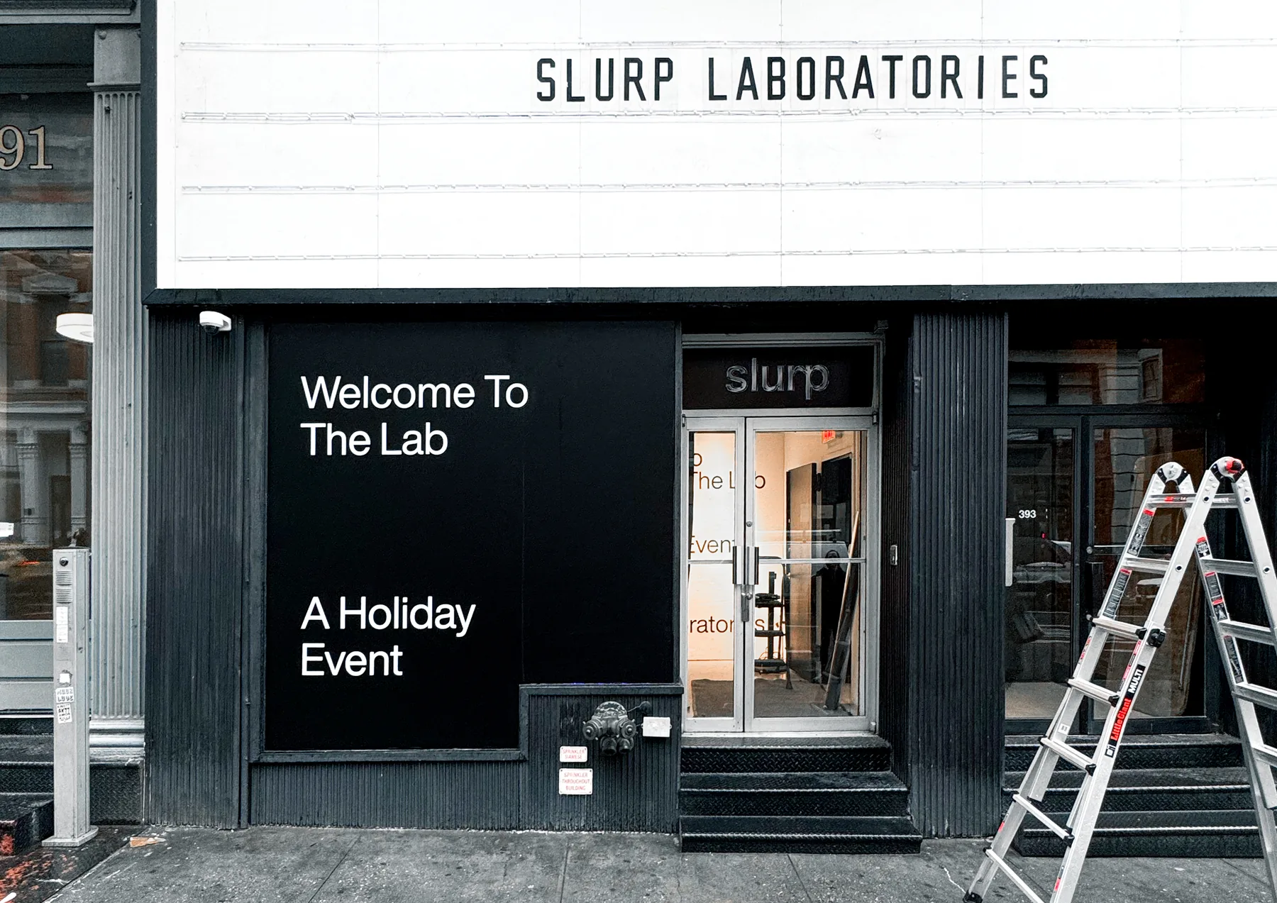 Slurp Laboratories storefront in New York with the Welcome To The Lab holiday window
